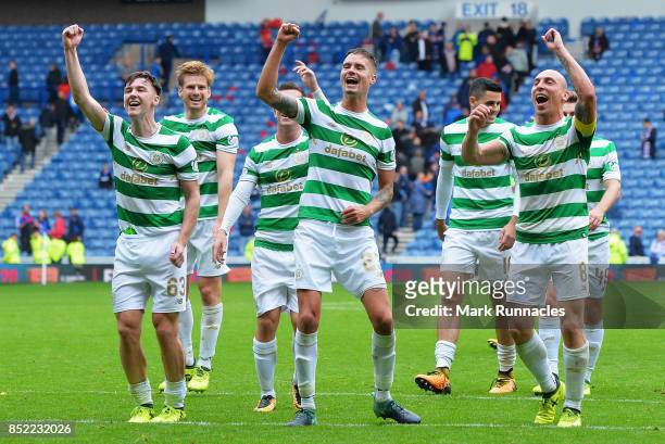 The Celtic team celebrate victory after the Ladbrokes Scottish Premiership match between Rangers and Celtic at Ibrox Stadium on September 23, 2017 in...