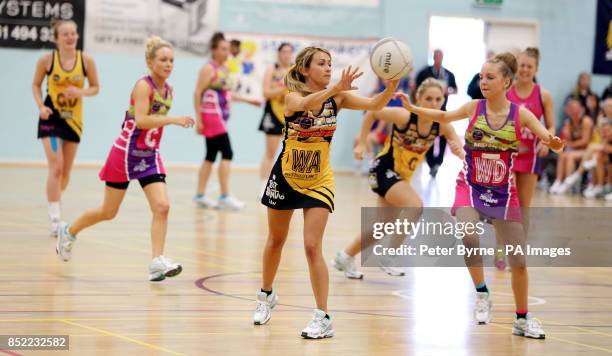 Samia Ghadie from Coronation Street passes the ball as Eden Taylor-Draper from Emmerdale looks on during a charity netball match between Coronation...