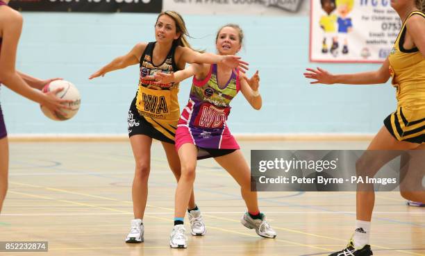 Samia Ghadie from Coronation Street fight for the ball with Eden Taylor-Draper from Emmerdale during a charity netball match between Coronation...