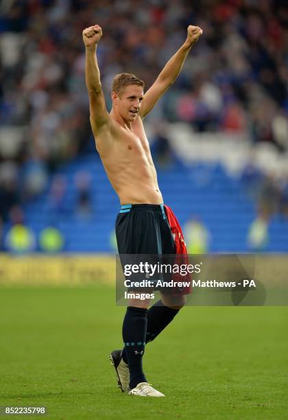 Tottenham Hotspur's Michael Dawson celebrates victory after the Barclays Premier League match at Cardiff City Stadium, Cardiff.