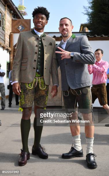 Franck Ribery and David Alaba of FC Bayern Muenchen attend the Oktoberfest beer festival at Kaefer Wiesnschaenke tent at Theresienwiese on September...