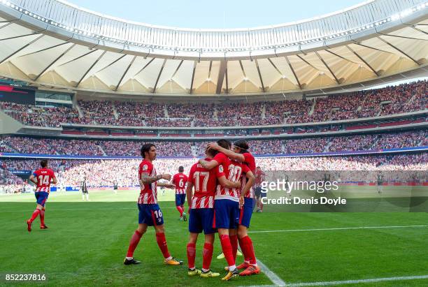 Yannick Carrasco of Club Atletico de Madrid celebrates after scoring his team's opening goal during the La Liga match between Atletico Madrid and...