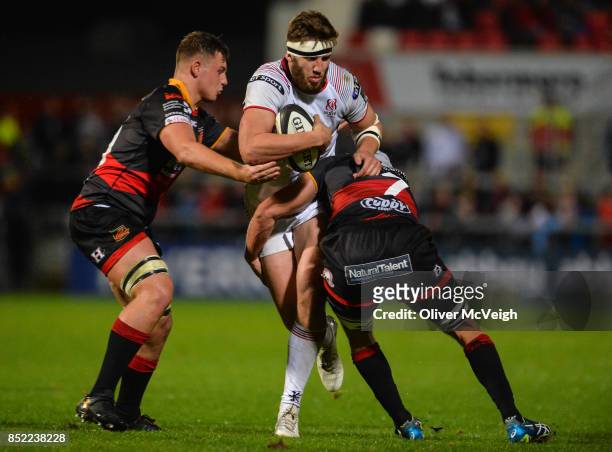 Antrim , United Kingdom - 22 September 2017; Stuart McCloskey of Ulster is tackled by Dorian Jones and Ollie Griffiths of Dragons during the Guinness...