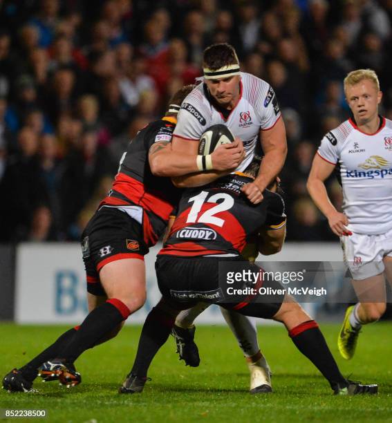 Antrim , United Kingdom - 22 September 2017; Robbie Diack of Ulster is tackled by Phil Price and Pat Howard of Dragons during the Guinness PRO14...