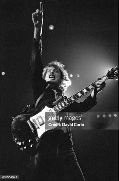 Angus Young of AC/DC performing at Hammersmith Odeon, London, 1st November 1979. He is playing a Gibson SG guitar.
