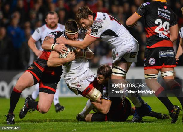Antrim , United Kingdom - 22 September 2017; Robbie Diack, supported by Iain Henderson of Ulster is tackled by Pat Howard of Dragons during the...