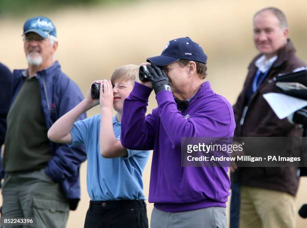 American Ryder Cup Captain Tom Watson looks through yardage finders during an event to mark the legacy of the 2014 Ryder Cup, at the PGA Cenetary...
