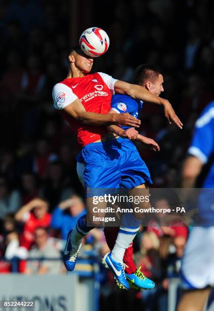 York City's Lewis Montrose and Portsmouth's Jed Wallace in action during the Sky Bet League Two match at Bootham Crescent, York.