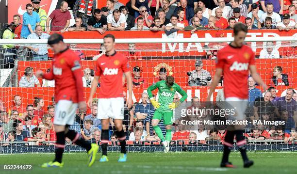 Manchester United's players including goalkeeper David De Gea stand dejected after West Bromwich Albion score