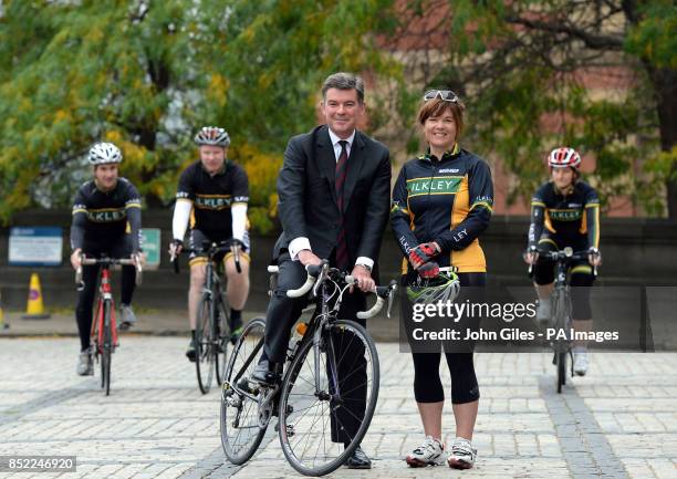 The Minister for Sport Hugh Robertson with Stephanie Millward of Ilkley Cycling Club during a photocall at the Town Hall, Leeds. The Minister was...