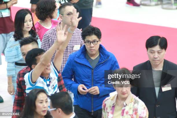 Businessman Kenneth Fok watches the charity performance of China's diving "Dream Team" on September 23, 2017 in Hong Kong, China.