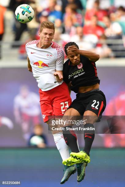 Marcel Halstenberg of Leipzig fights for the ball with Timothy Chandler of Frankfurt during the Bundesliga match between RB Leipzig and Eintracht...