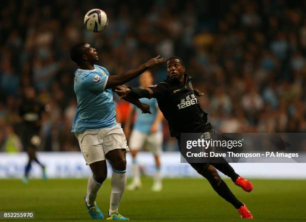 Manchester City's Micah Richards and Wigan Athletic's Juan Carlos Garc&iacute;a during the Capital One Cup, Third round match at the City of...