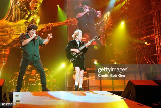 Photo of AC/DC, Brian Johnson and Angus Young performing live onstage