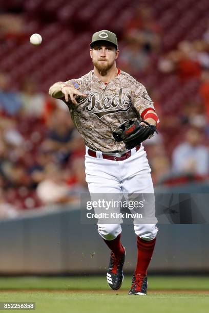 Patrick Kivlehan of the Cincinnati Reds throws the ball to first base during the game against the St. Louis Cardinals at Great American Ball Park on...