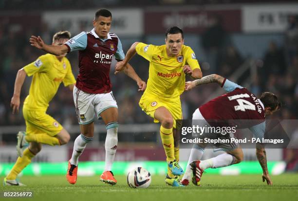 West Ham United's Ravel Morrison and Cardiff City's Don Cowie compete for the ball during the Capital One Cup, Third round match at Upton Park,...