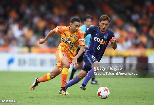 Tiago Alves of Shimizu S-Pulse and Toshihiro Aoyama of Sanfrecce Hiroshima compete for the ball during the J.League J1 match between Shimizu S-Pulse...