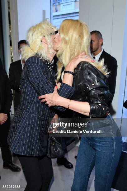 Ellen von Unwerth and Claudia Schiffer attend Claudia Schiffer book launch cocktail at Versace Boutique during Milan Fashion Week Spring/Summer 2018...