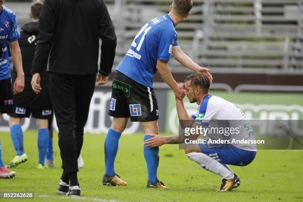 Linus Wahlqvist of IFK Norrkoping is comforted by Andreas Bengtsson of Halmstad BK after the game at Orjans Vall on September 23, 2017 in Halmstad,...