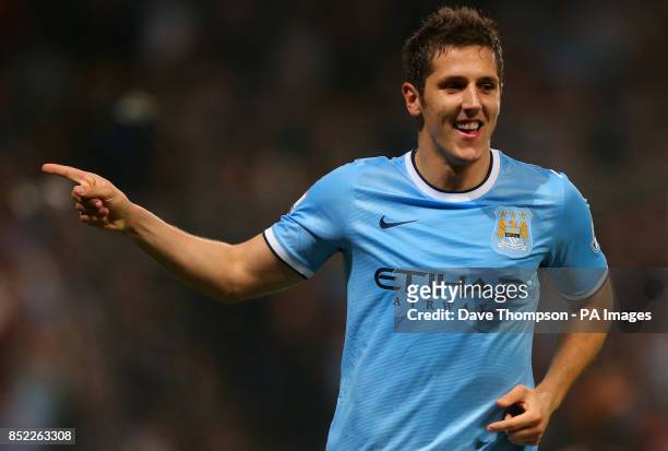 Manchester City's Stevan Jovetic celebrates scoring against Wigan Athletic during the Capital One Cup, Third round match at the City of Manchester...