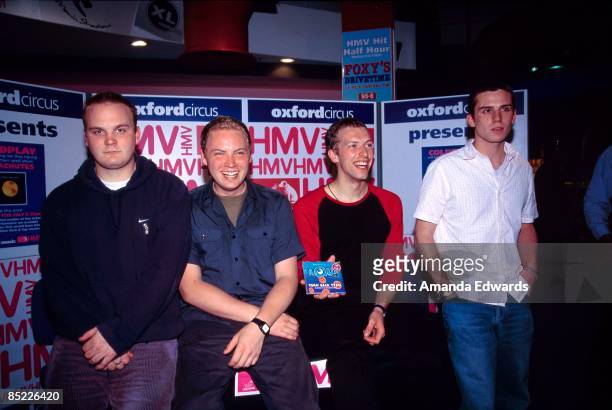 Photo of COLDPLAY, L-R: Will Champion, Jonny Buckland, Chris Martin, Guy Berryman - posed, group shot at instore appearance