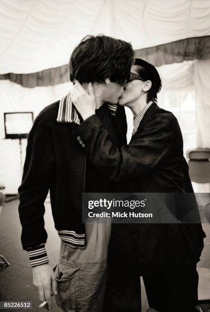 Alex James kissing Justine Andrew backstage at the RDS Showgrounds