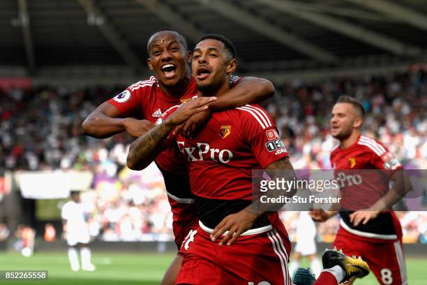 Andre Gray of Watford celerbates scoring the opening goal during the Premier League match between Swansea City and Watford at Liberty Stadium on...