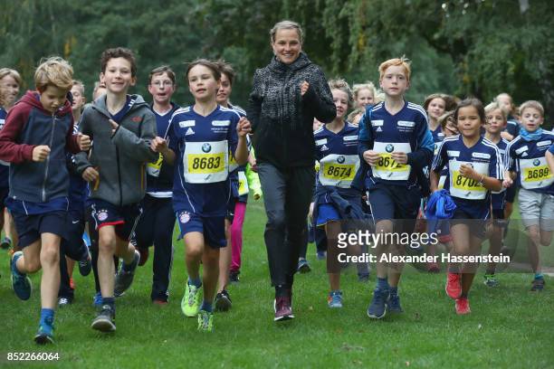 Lisa Hahner warms-up with starters for the school mini Marathon ahead of the BMW Berlin Marathon 2017 on September 23, 2017 in Berlin, Germany.