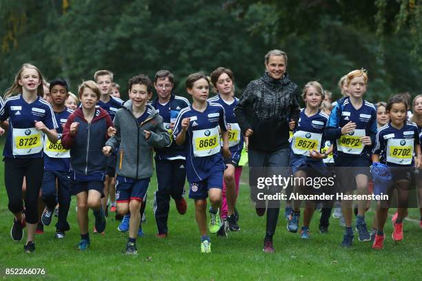 Lisa Hahner warms-up with starters for the school mini Marathon ahead of the BMW Berlin Marathon 2017 on September 23, 2017 in Berlin, Germany.