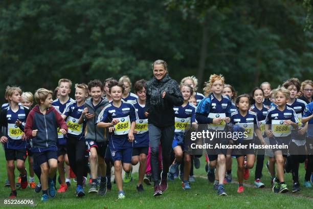 Lisa Hahner warms-up with starters for the school mini Marathon ahead of the BMW Berlin Marathon 2017 on September 23, 2017 in Berlin, Germany.