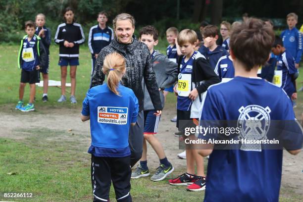 Lisa Hahner warms-up with starters for the school mini Marathon ahead of the BMW Berlin Marathon 2017 on September 23, 2017 in Berlin, Germany.