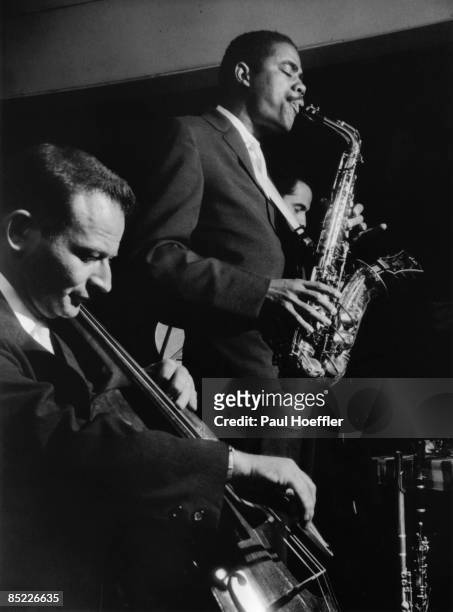 Photo of Eric DOLPHY and Nat GERSHMAN and John PISANO, L-R Nat Gershman, Eric Dolphy and John Pisano performing on stage at the Ridgecrest Inn