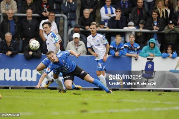 Christopher Telo of IFK Norrkoping competes for the ball with Andreas Bengtsson of Halmstad BK at Orjans Vall on September 23, 2017 in Halmstad,...