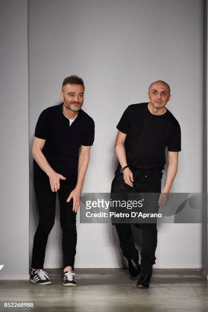 Tommaso Aquilano and Roberto Rimondi acknowledge the applause of the audience at the Aquilano.Rimondi show during Milan Fashion Week Spring/Summer...