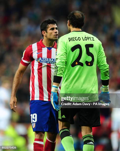 Atletico Madrid's Diego Costa argues with Real Madrid goalkeeper Diego Lopez