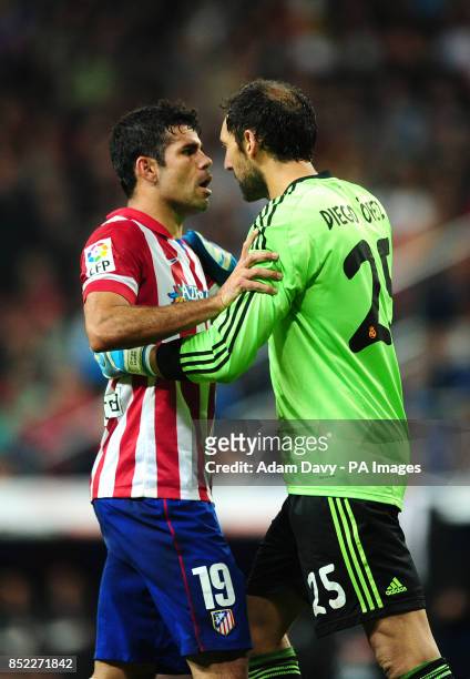 Atletico Madrid's Diego Costa argues with Real Madrid goalkeeper Diego Lopez