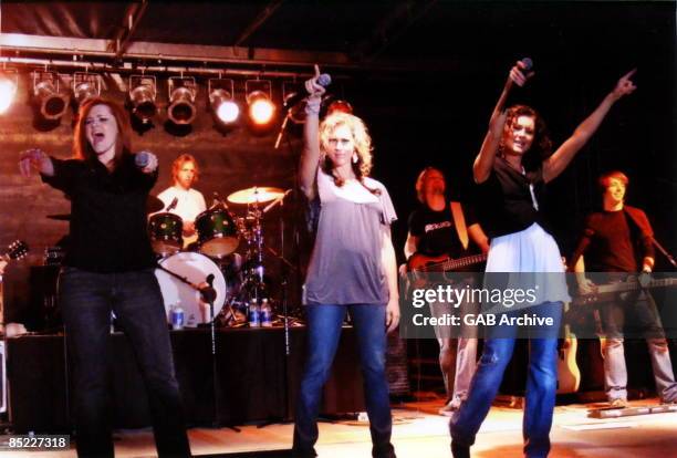 Photo of SHEDAISY; Kelsi, Kristyn and Kassidy Osborn performing live on stage