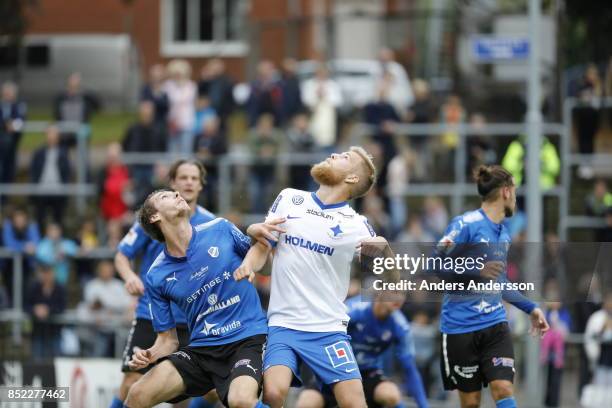 Marcus Johansson of Halmstad BK and Filip Dagerstal of IFK Norrkoping waits for the ball to come down at Orjans Vall on September 23, 2017 in...