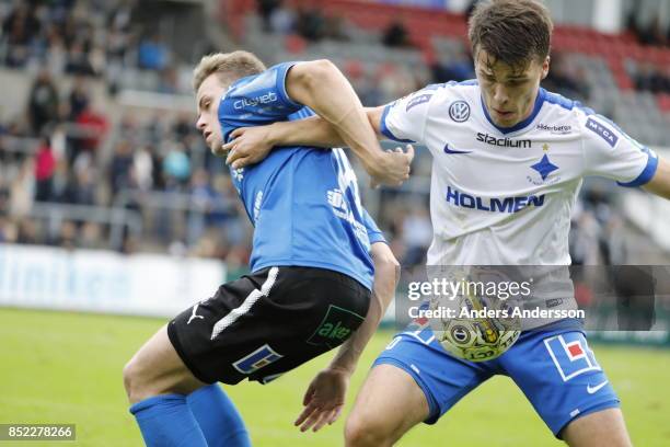 Gabriel Gudmundsson of Halmstad BK and Simon Skrabb of IFK Norrkoping competes for the ball at Orjans Vall on September 23, 2017 in Halmstad, Sweden.