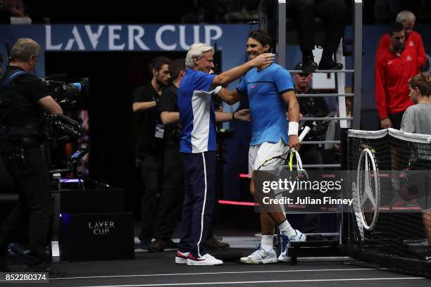 Rafael Nadal of Team Europe celebrates with Bjorn Borg, Captain of Team Europe after winning his singles match against Jack Sock of Team World on Day...