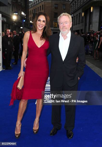 Ridley Scott and Giannina Facio arriving at a special screening of new film The Counselor at the Odeon West End, London.
