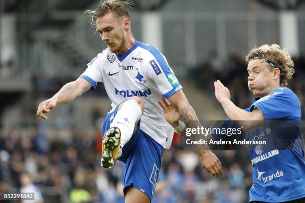 Linus Wahlqvist of IFK Norrkoping and Höskuldur Gunnlaugsson of Halmstad BK competes for the ball at Orjans Vall on September 23, 2017 in Halmstad,...