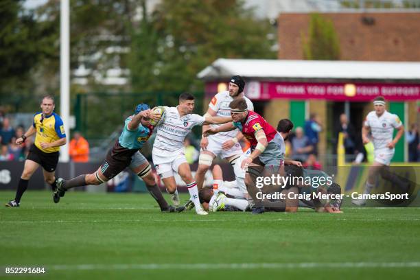 Leicester Tigers' Ben Youngs hands off Harlequins' Jack Clifford to make a break during the Aviva Premiership match between Harlequins and Leicester...