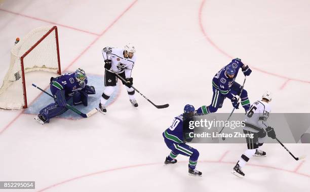 Erik Gudbranson of Vancouver Canucks skates against Nic Dowd of Los Angeles Kings during the pre-season game between the Los Angeles Kings and the...