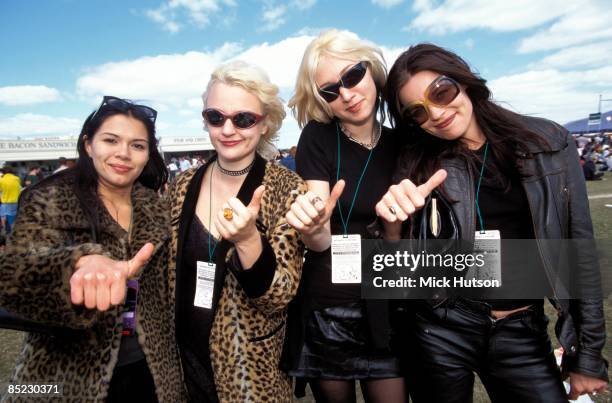 Photo of FLUFFY; drummer Angie Adams, vocalist Amanda E. Rootes, bassist Helen Storer, guitarist Bridget Jones