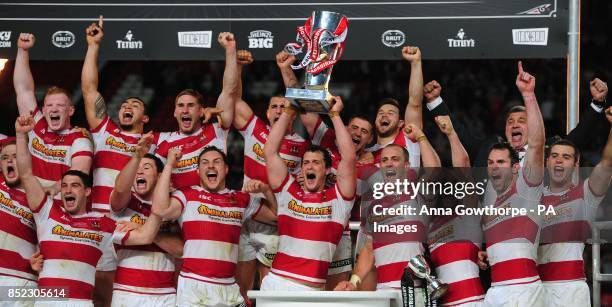 Wigan Warriors' celebrate with the trophy after winning the Super League Grand Final at Old Trafford, Manchester.
