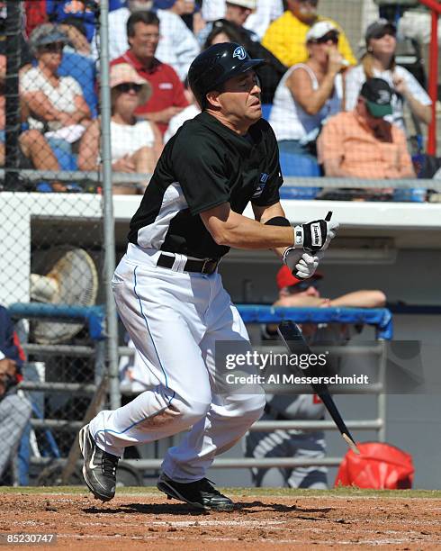 Infielder John McDonald of the Toronto Blue Jays breaks a bat against the USA World Baseball team in an exhibition game on March 4, 2009 at Dunedin...