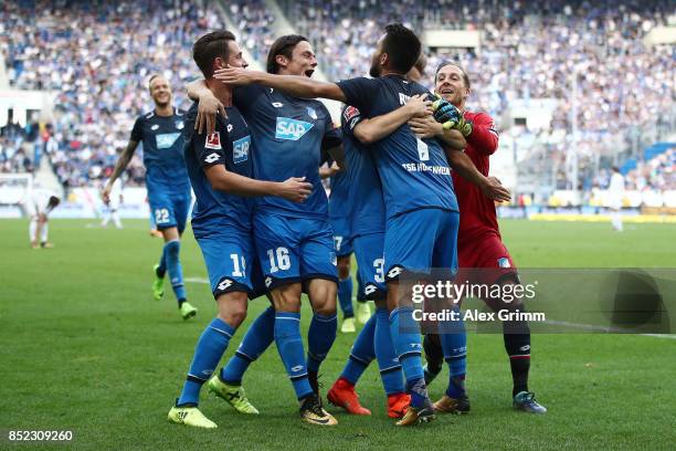 Lukas Rupp of Hoffenheim celebrates with team mates after he scored his teams second goal to make it 2:0 during the Bundesliga match between TSG 1899...