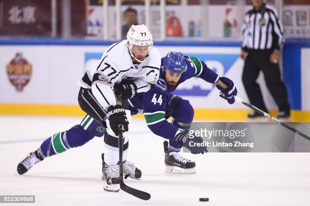 Erik Gudbranson of Vancouver Canucks skates against Jeff Carter of Los Angeles Kings during the pre-season game between the Los Angeles Kings and the...