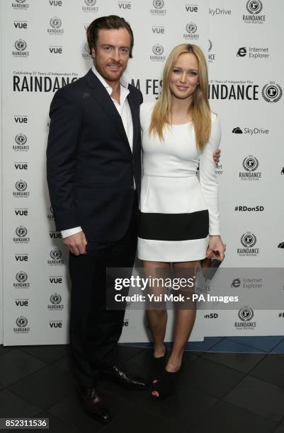 Cast members Toby Stephens and Caity Lotz arriving for the UK premiere of The Machine, as part of the 21st Raindance Film Festival, at Vue...